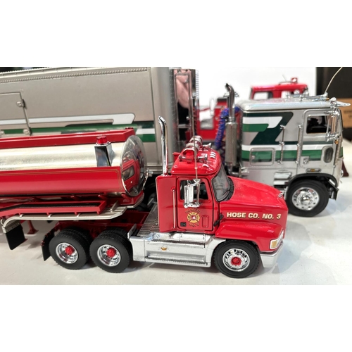 342 - Three large scale diecast vehicles, a fire engine, a tanker and a freighter.