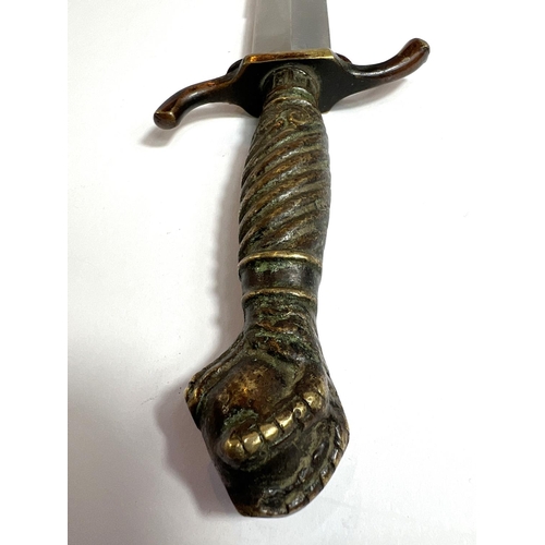 42 - A German hunting/commando-style dagger with brass handle and ball and claw terminal, marked 