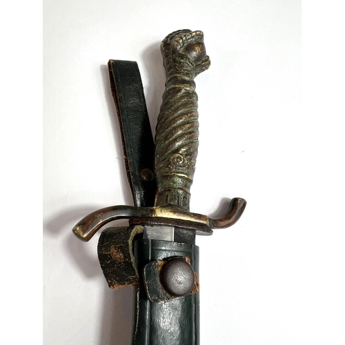 42 - A German hunting/commando-style dagger with brass handle and ball and claw terminal, marked 