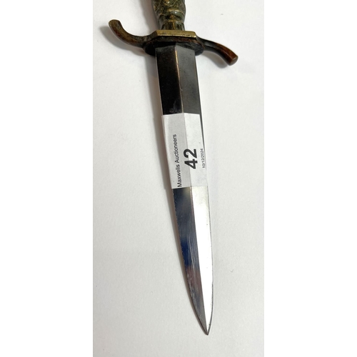 42 - A German hunting/commando-style dagger with brass handle and ball and claw terminal, marked 