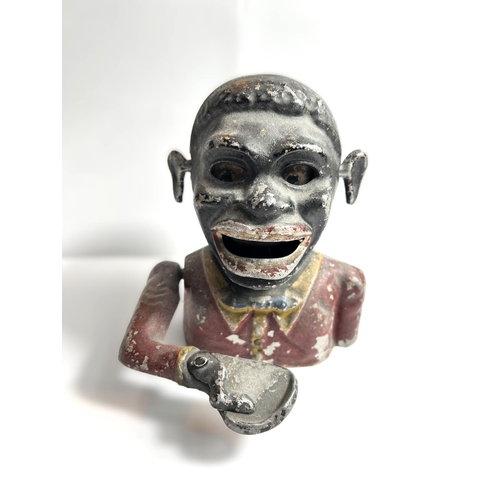 43 - A Black Boy cast metal money box and a selection of collectors items including:- military badges, ci... 