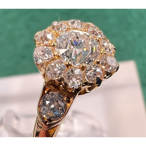 628 - A lady's yellow metal dress ring set with central old cut diamond,&nbsp; approx. 0.5ct surrounded by... 
