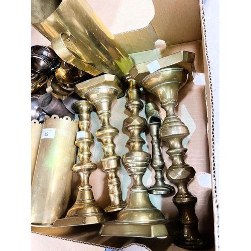 69 - Two pairs of brass candlesticks; brass shell case trench art, martingales with horse brasses.