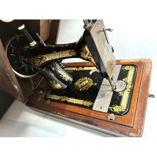 75 - A late 19th century Singer hand operated sewing machine in mahogany case.