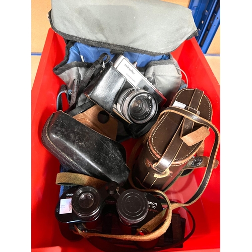 80 - A pair of CANON 8 x 30 binoculars, a MINOLTA Hi-Matic 9 camera.