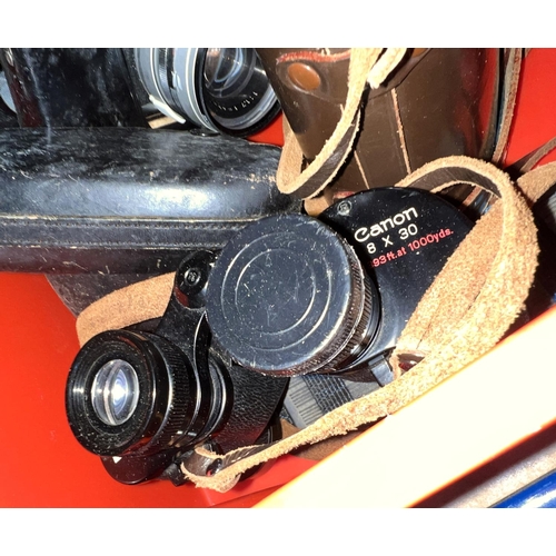 80 - A pair of CANON 8 x 30 binoculars, a MINOLTA Hi-Matic 9 camera.