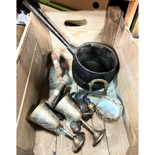 81 - Two vintage watering cans 1.5 gallons and a cast metal cook pan, dog door stop etc.