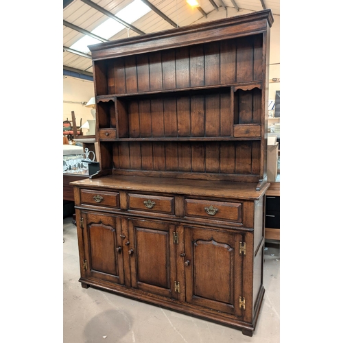 838 - A Titchmarsh and Goodwin golden oak Welsh dresser with three cupboards and three drawers below, two ... 