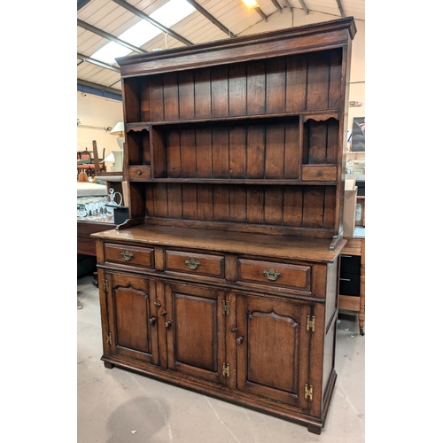 838 - A Titchmarsh and Goodwin golden oak Welsh dresser with three cupboards and three drawers below, two ... 