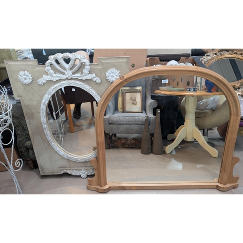 858 - A pine framed overmantle mirror; an oval wall mirror in limed wood frame.