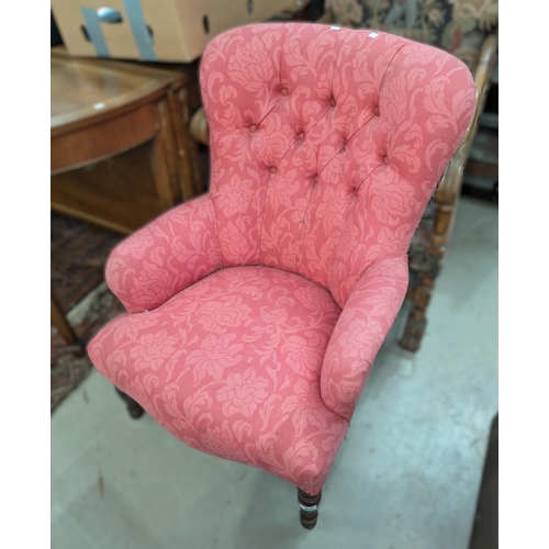 850 - A Victorian style armchair in buttoned pink fabric; a long footstool in green/blue fabric.