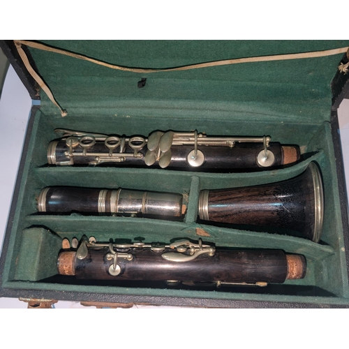 67A - H. Meunier early 20th Century clarinet in case, signed.