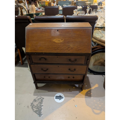 838A - A mahogany Sheraton style inlaid bureau 