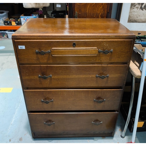 863 - An oak Art Deco part bedroom suite comprising chest of drawers, oak tallboy and two matched bedside ... 