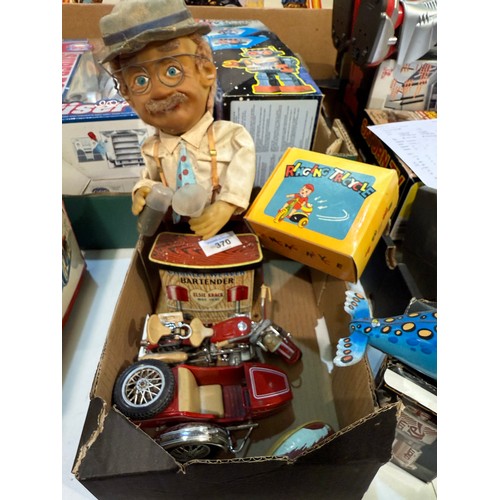 370 - A vintage tin plate battery operated Charley Weaver Bartender, other tin plate toys etc.