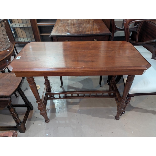 989 - A mahogany aesthetic style movement table and an octagonal wine table.