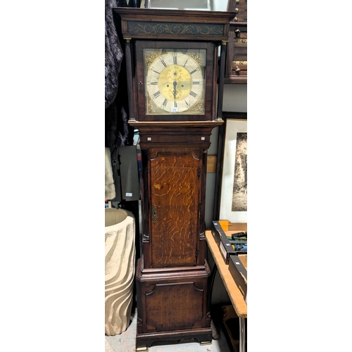 985 - An 18th Century oak longcase clock with cross banded decorated, the door with reeded columns, 1/4 re... 