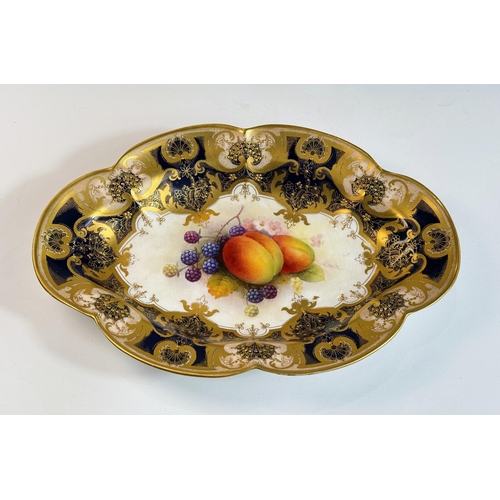 696 - Royal Worcester: an oval porcelain fruit dish decorated with peaches and blackberries, signed A SHUC... 