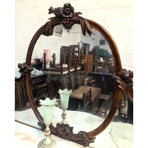 984B - A Victorian simulated zebra wood mirror back chiffonier, the raised oval back with carved fruit and ... 