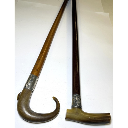 108 - Two silver-mounted horn-handled walking sticks, 90cm each, circa 1900 (2).