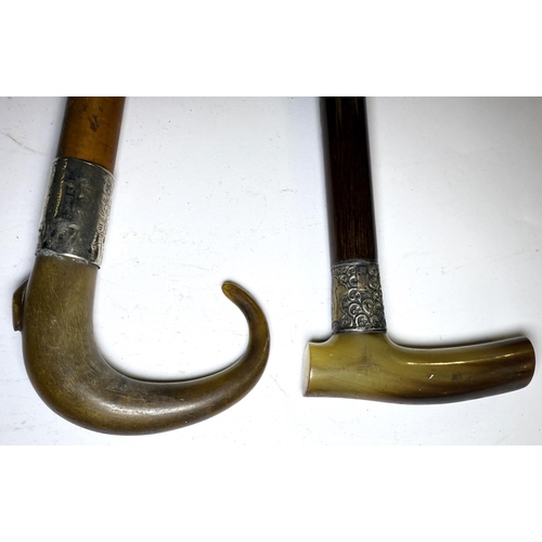 108 - Two silver-mounted horn-handled walking sticks, 90cm each, circa 1900 (2).