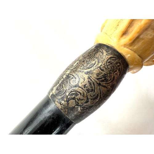 14 - A 19th Century ebony stick with carved ivory handle of a greyhound, 91cms.WITHDRAWN FROM THIS SALE -... 