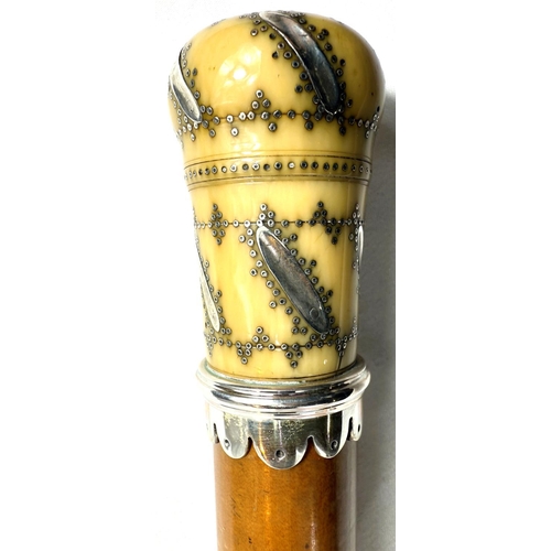 15 - A Georgian Malacca cane walking stick with silver pique work ivory finial (the pierced top unscrews ... 