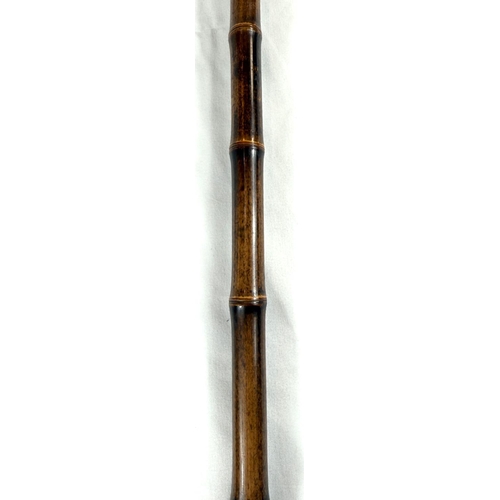 18 - A novelty 19th Century cane walking stick, the carved ivory finial in the form of a police constable... 