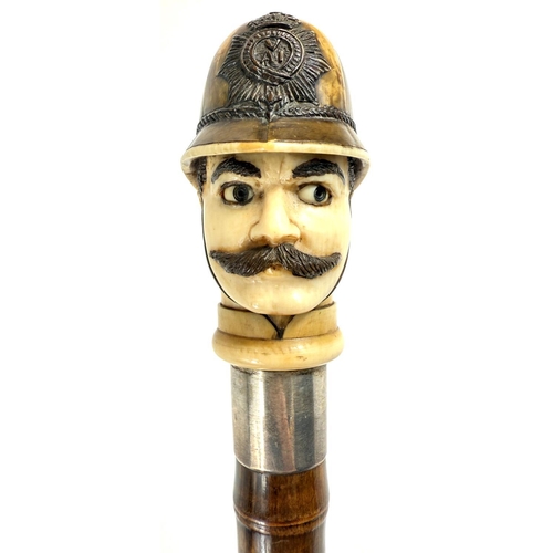 18 - A novelty 19th Century cane walking stick, the carved ivory finial in the form of a police constable... 