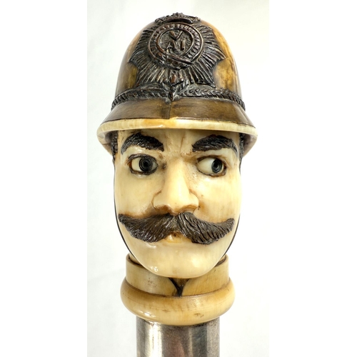 18 - A novelty 19th Century cane walking stick, the carved ivory finial in the form of a police constable... 