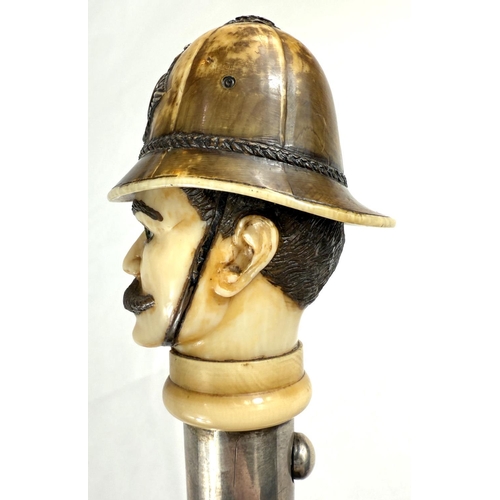 18 - A novelty 19th Century cane walking stick, the carved ivory finial in the form of a police constable... 