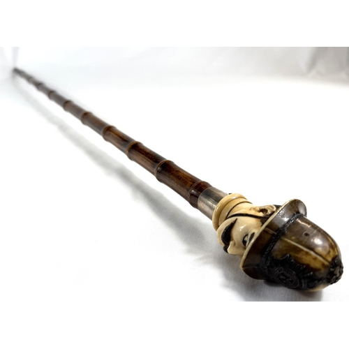 18 - A novelty 19th Century cane walking stick, the carved ivory finial in the form of a police constable... 