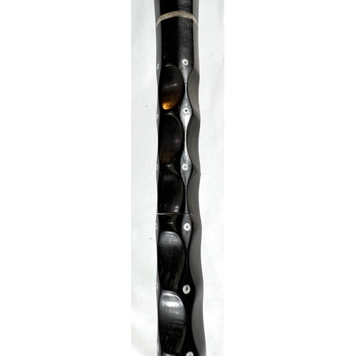 2 - A late 19th/early 20th Century Indian horn walking stick with ivory dot inlays and six others simila... 