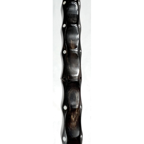 2 - A late 19th/early 20th Century Indian horn walking stick with ivory dot inlays and six others simila... 