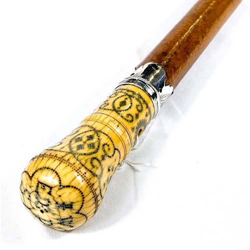 20 - A FINE mid-Georgian Malacca cane walking stick with silver-mounted and pique work polished ivory fin... 