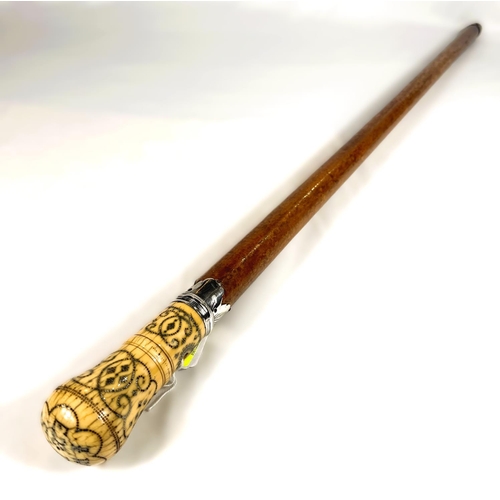 20 - A FINE mid-Georgian Malacca cane walking stick with silver-mounted and pique work polished ivory fin... 