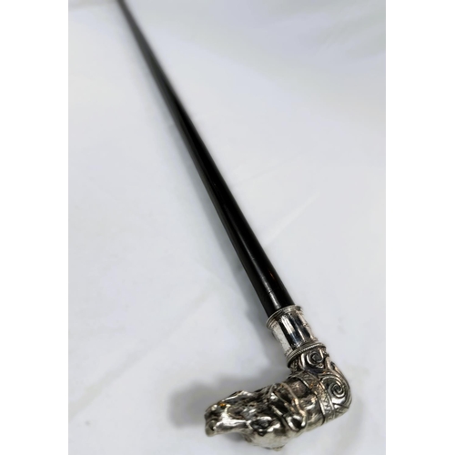 231 - A 19th Century ebonised walking stick with ornate silver-plated dog's head finial, 88cm.