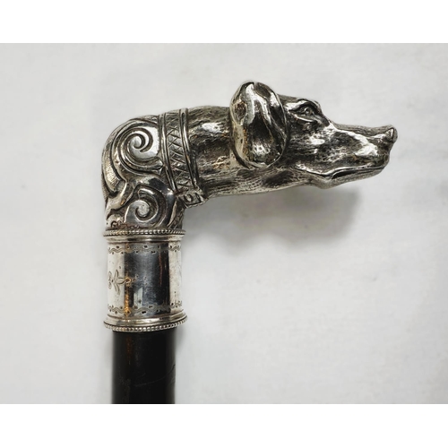 231 - A 19th Century ebonised walking stick with ornate silver-plated dog's head finial, 88cm.