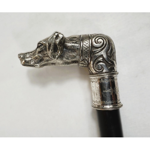 231 - A 19th Century ebonised walking stick with ornate silver-plated dog's head finial, 88cm.