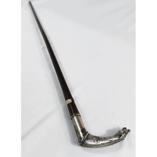 232 - A French 19th Century lady's riding stick with double horse head silver handle, 83cm.