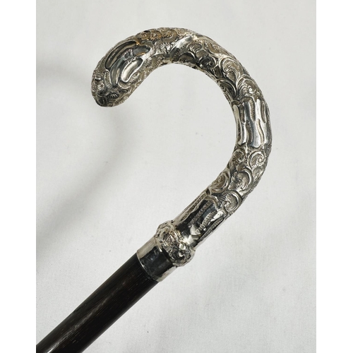 247 - An Edwardian period lady's stick with embossed silver mounted loop handle, London, 1907, 89cm.