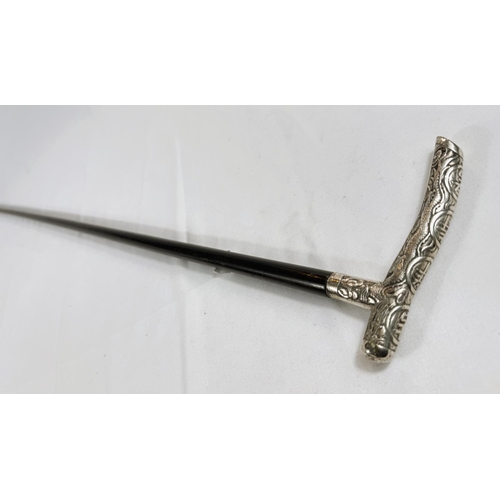 248 - A Chinese lady's ebonised walking stick with silver handle embossed with characters, 90cm.