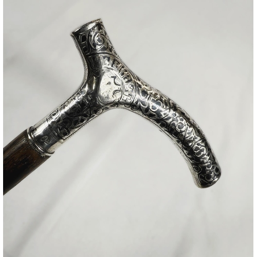 251 - A late 19th Century Russian ebonised walking stick with 84 standard silver handle decorated in niell... 