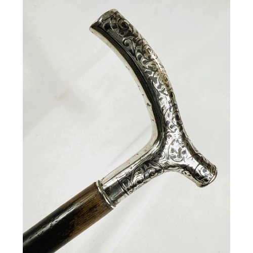 251 - A late 19th Century Russian ebonised walking stick with 84 standard silver handle decorated in niell... 