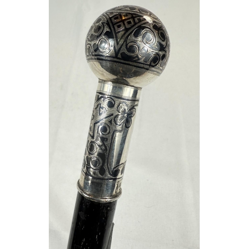 252 - A 19th Century Russian ebonised walking stick with 84 standard silver globe and shaft and decorated ... 