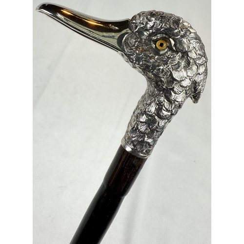 253 - A late Victorian lady's ebonised stick with silver band having vacant cartouche and silver bird's he... 