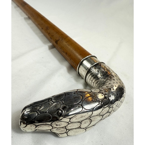 260 - A 19th Century heavy Malacca cane walking stick with silver handle in the form of a snake's head (un... 