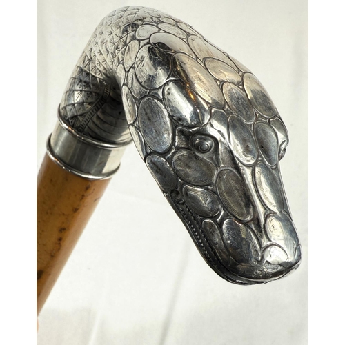 260 - A 19th Century heavy Malacca cane walking stick with silver handle in the form of a snake's head (un... 