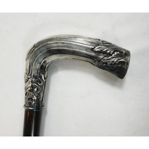 265 - An English walking stick circa 1900 with hardwood shaft and hallmarked silver cased handle with ribb... 