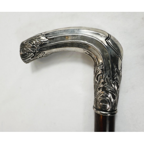 265 - An English walking stick circa 1900 with hardwood shaft and hallmarked silver cased handle with ribb... 